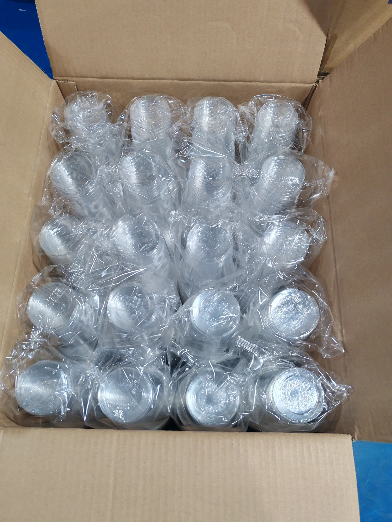 Clear PET cups packed in carton with protective plastic bags